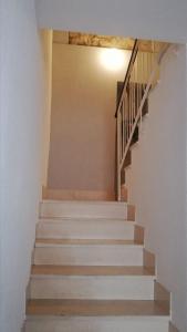 a staircase in a house with white walls at Novalja centar in Novalja