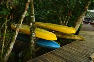 three surfboards stacked on top of each other at Hotel Kangaroo y Restaurante in Río Dulce