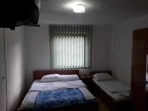 Postel nebo postele na pokoji v ubytování Motel Tetrijeb Sipovo