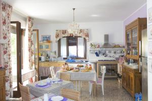 a kitchen with a table with food on it at B&B La casa di g.g. in Grottammare
