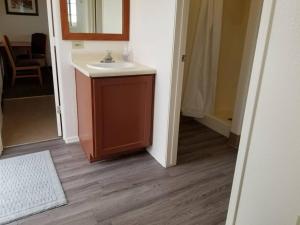 a bathroom with a sink and a mirror at 072A Affordable Getaway near South Rim Sleeps 4- No Kitchenette in Valle +11 photos