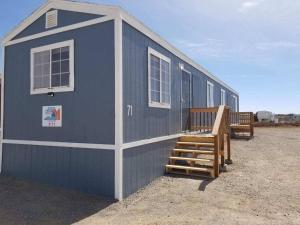 a blue building with a staircase and two benches at 071A Private Studio near South Rim Sleeps 6- No Kitchen in Valle