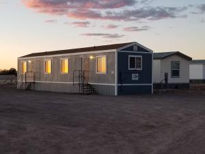 a small house is sitting in a field at 072A Affordable Getaway near South Rim Sleeps 4- No Kitchenette in Valle
