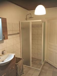 a bathroom with a shower and a sink at RIVER HOUSE MARIA in Lefkímmi