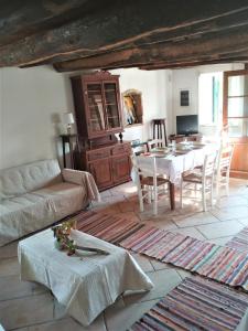 a living room with a couch and a table at RIVER HOUSE MARIA in Lefkimmi