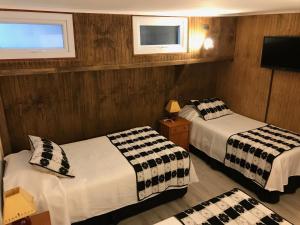 Postel nebo postele na pokoji v ubytování Hotel Luanco