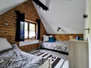 Postel nebo postele na pokoji v ubytování Vaskúti Faház