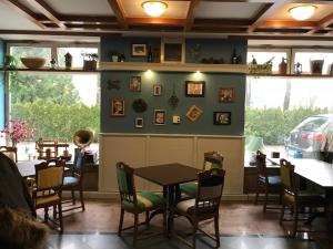 a dining room with a table and chairs at Guest House Park Žibert in Ljubljana