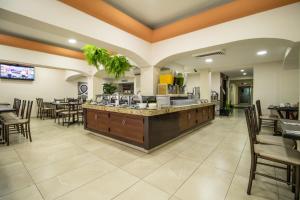 TV a/nebo společenská místnost v ubytování Howard Johnson by Wyndham Veracruz