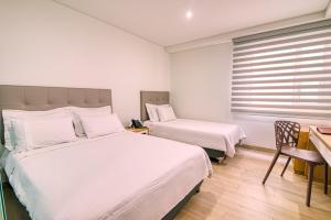 Ένα ή περισσότερα κρεβάτια σε δωμάτιο στο Hotel Dix