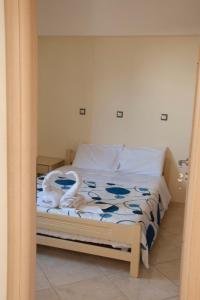 Postel nebo postele na pokoji v ubytování Minas-Maria House