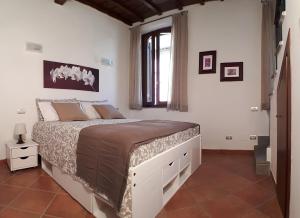 Posteľ alebo postele v izbe v ubytovaní Alloggio turistico La Casa del Vignola