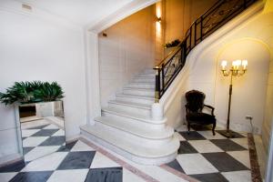 a staircase in a house with a checkered floor at Casa Bueras Boutique Hotel in Santiago