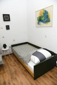 Uma cama ou camas num quarto em Citadela