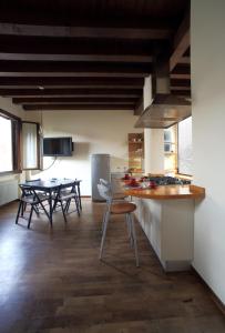 a kitchen and dining room with a table and chairs at DIMORA CECILIA, nel cuore della città in Vicenza +11 photos