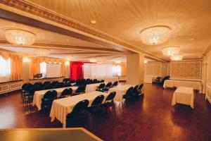 a banquet hall with white tables and chairs at Hotel Moncton in Moncton +13 photos