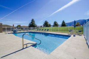 a large swimming pool with a fence around it at Lake Life at Wapato Point in Manson