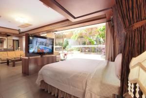 Postel nebo postele na pokoji v ubytování Q Motel精品旅館 + 37 fotografií