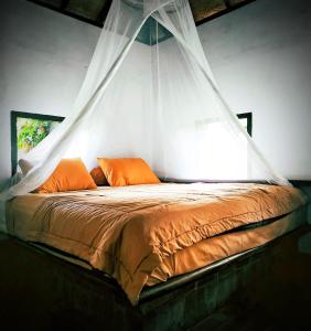 A bed or beds in a room at Ecolodge Seloliman