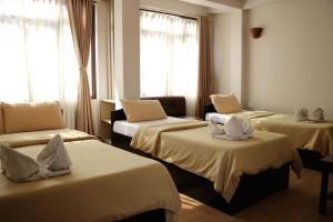 Ένα ή περισσότερα κρεβάτια σε δωμάτιο στο Hotel Yala Peak