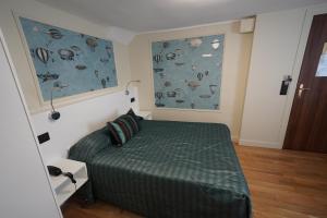 Un ou plusieurs lits dans un hébergement de l'établissement Hotel Montpensier