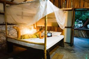 
A bed or beds in a room at Valampuri Kite Resort
