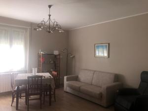 a living room with a couch and a table at GIUSY’ S HOUSE in Sulmona