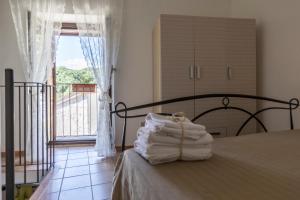 Кровать или кровати в номере La casa in pietra