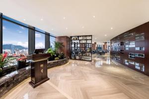 an office with a podium in the middle of a building at Huaqiang Plaza Hotel Shenzhen, Enjoy Complimentary Mini Bar & Night Snack, Add breakfast - enjoy complimentary afternoon tea in Shenzhen