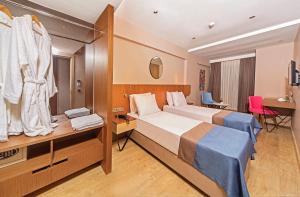מיטה או מיטות בחדר ב-Redmont Hotel Nisantasi