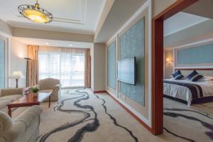 Voodi või voodid majutusasutuse Chongqing Liyuan Hotel toas