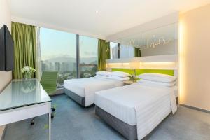 Cama o camas de una habitación en Dorsett Tsuen Wan, Hong Kong
