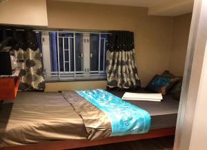 Voodi või voodid majutusasutuse Rich Hostel toas