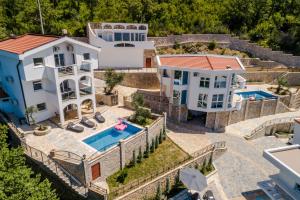 an aerial view of a house with a swimming pool at Dolaca Villas in Sutomore