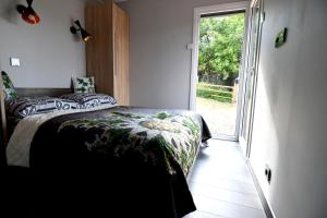 Łóżko lub łóżka w pokoju w obiekcie Zamkowe Wzgórze