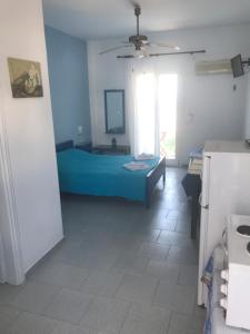 A bed or beds in a room at Studios Panorama Drios