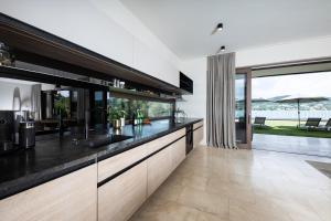 a kitchen with a sink and a counter top at Linde Villas in Maria Wörth