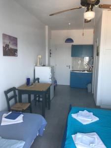 A bed or beds in a room at Studios Panorama Drios