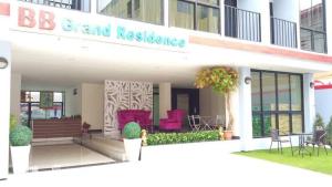 a building with a sign that reads b grand residence at BB Grand Residence in Pattaya