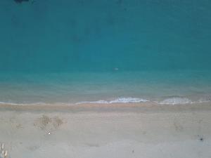 an aerial view of a beach with the ocean at Riviera Perdika Hotel in Perdika