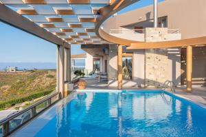 Piscina a Minimalist Mediterranean Blue key Villa with Sea View & Infinity Heated Pool o a prop