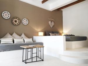a living room with a bed and a table at STELLA MARINA in Panteli