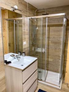 a bathroom with a sink and a shower at Villaggio Turistico Camping Cervino in Antey-Saint-André
