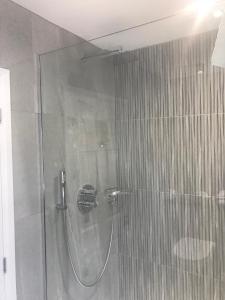 a bath room with a shower and a toilet at Crabwall Manor Hotel & Spa in Chester