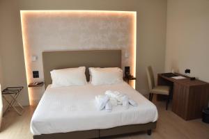 Postel nebo postele na pokoji v ubytování Hotel Commercio