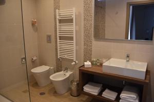 Koupelna v ubytování Hotel Commercio