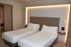 Postel nebo postele na pokoji v ubytování Hotel Commercio