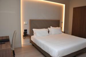 Postel nebo postele na pokoji v ubytování Hotel Commercio