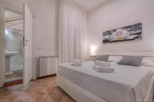 Posteľ alebo postele v izbe v ubytovaní Wine Apartments Florence Moscato
