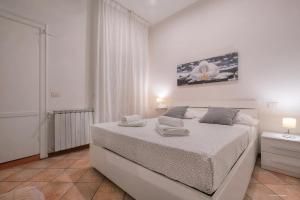 Posteľ alebo postele v izbe v ubytovaní Wine Apartments Florence Moscato